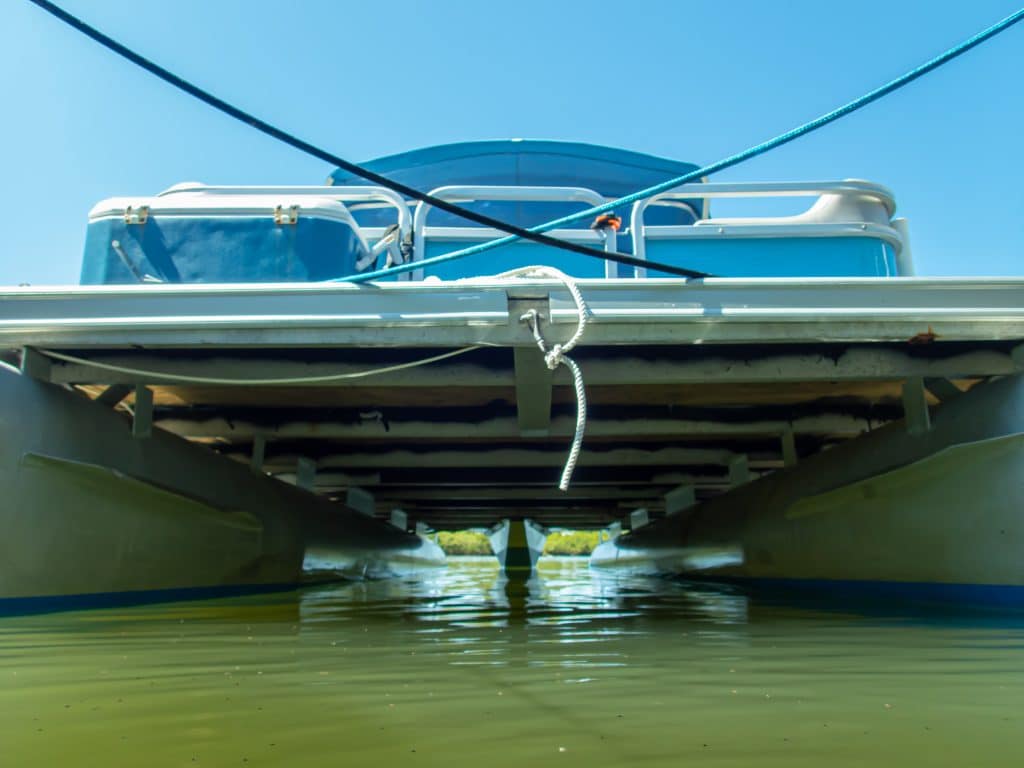 underside of a pontoon boat, in salt water